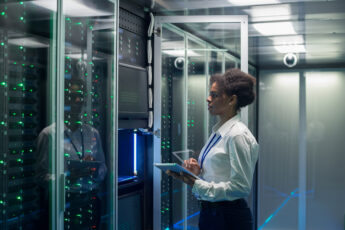 Female technician works in a data center